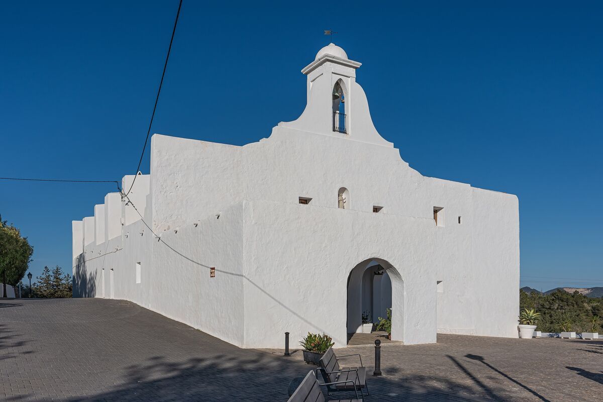 The whitewashed church of Sant Rafel de sa Creu among olive groves in the Ibizan countryside